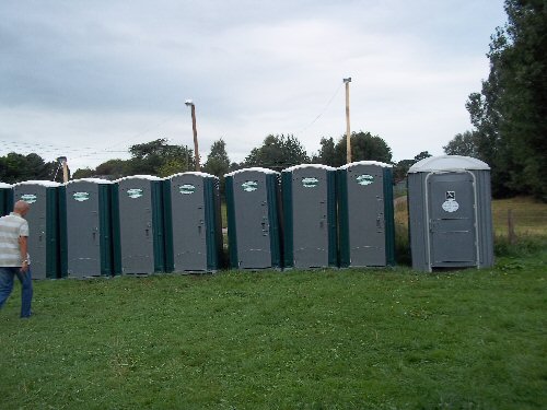 Single portable toilets at an event Gallery Image