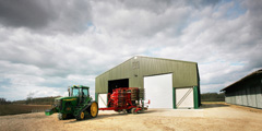 Grain Store, Norfolk.
Steel portal frame, fibre-cement roof cladding, single skin metal wall cladding, concrete grain wall panels, galvanised roller shutter doors &  steel personnel doors. Gallery Image