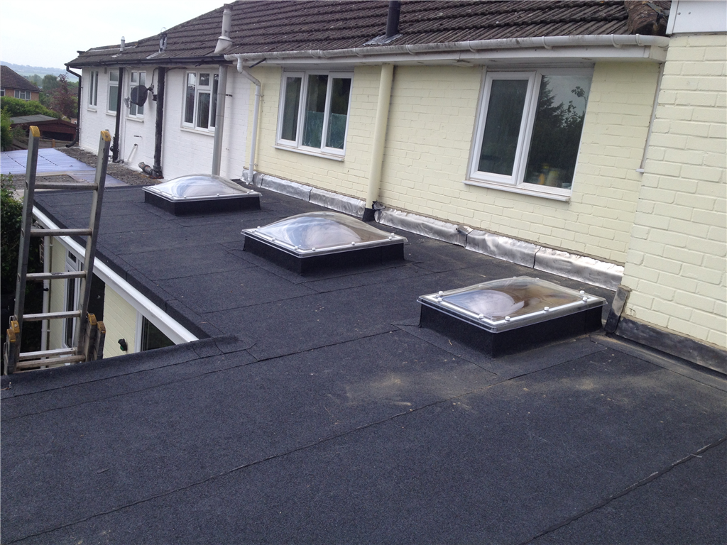 Stocker Close, Basingstoke.
removing corrugated sheeting and constructing new flat roof with
Andersons tecnatorch charcoal mineral system Gallery Image