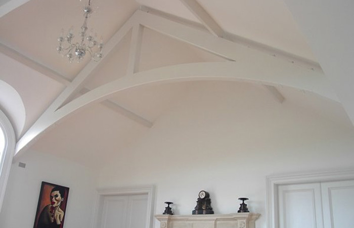 Softwood glulam trusses, with hidden metal work encased. Gallery Image