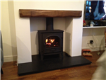 Stovax Stockton 7 Honed Black Granite hearth and Rustic Oak Beam Gallery Thumbnail