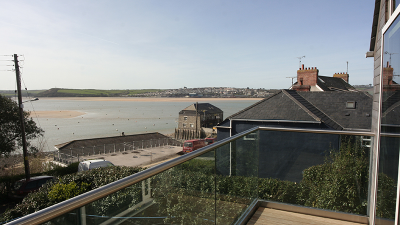 POSIglaze balustrade fitted to a balcony in Cornwall. POSIglaze is the perfect solution for a windbreak that keeps the amazing views.  Gallery Image