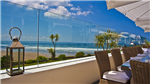 Glass windbreak held securely in place by Pure Vista balustrade. This amazing Devon location has benefitted from keeping the ocean view for their customers.  Gallery Thumbnail