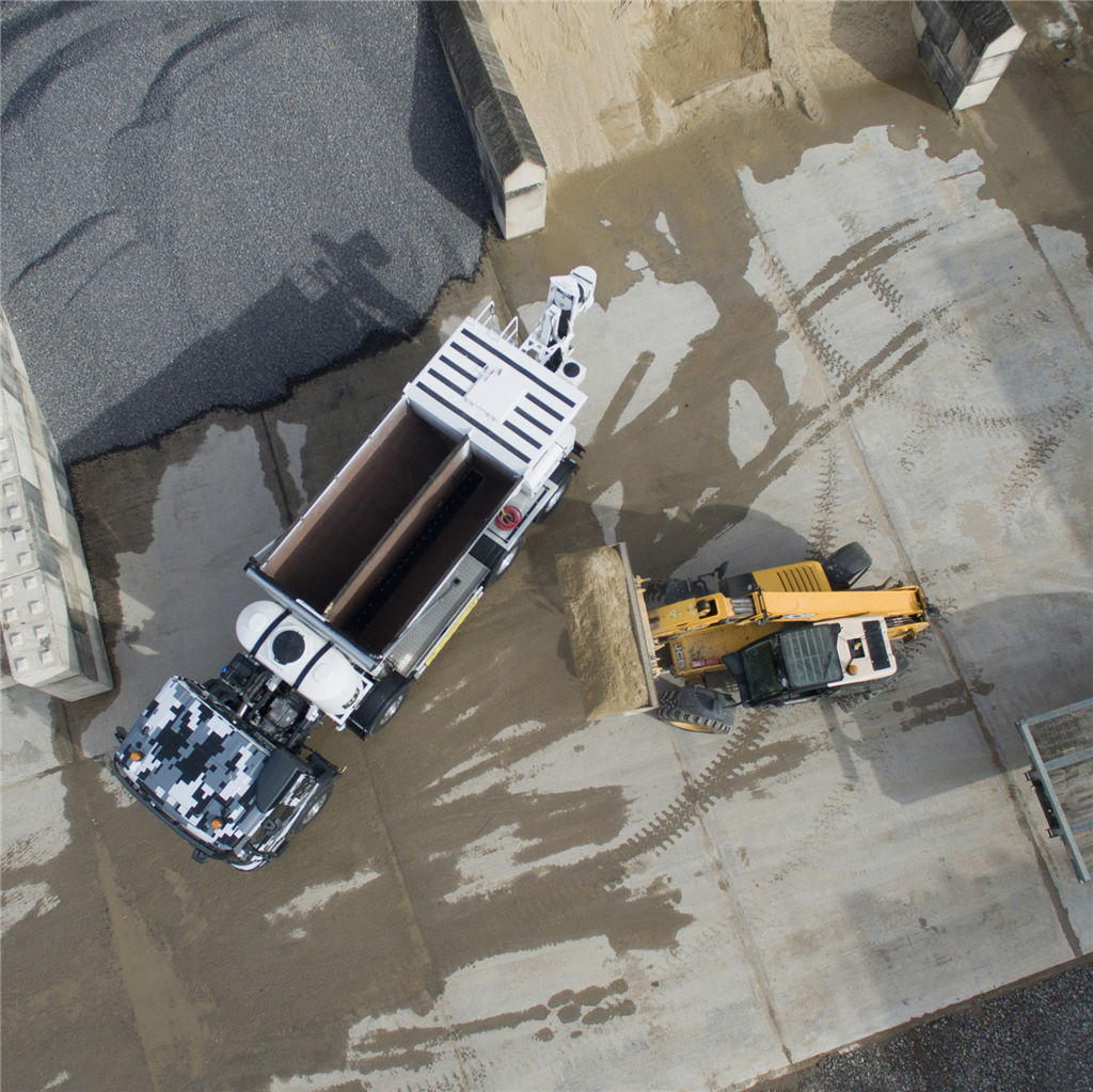 drone picture of ready mix volumetric concrete in somerset being poured at a farm in somerset at hopkins estates Gallery Image