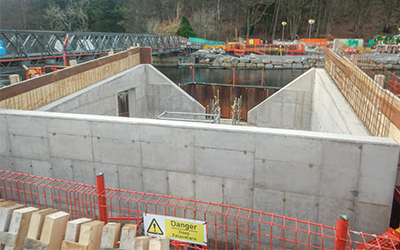 Pooley Bridge, England. 
Betts Construction formed the abutments within the cofferdams using the EFCO HAND-E-FORM system. These all-steel face sheets leave a single line. Gallery Image