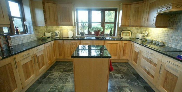 A burr ash kitchen on an underfloor heated granite floor is a delightful place to cook! Gallery Image