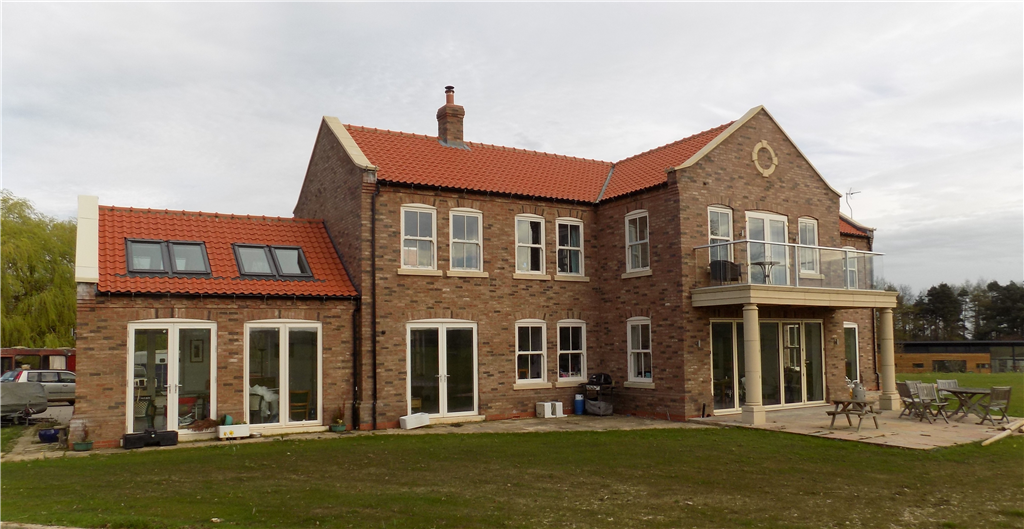 A new country residence in the Yorkshire Wolds, incorporating Passive Solar Design Principles coupled to a ground source heat pump and HVR giving a Code 5 sustainable home with very low running costs! Gallery Image