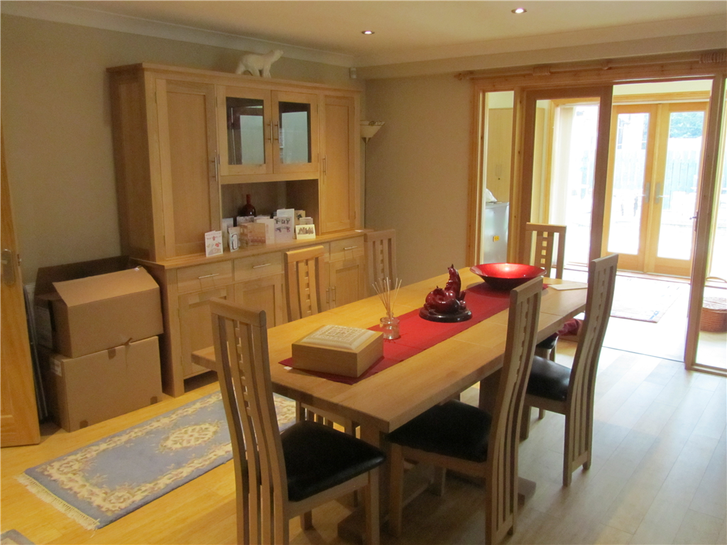 A lovely dining room opening into both the lounge and home study, all with feature bamboo flooring! Gallery Image